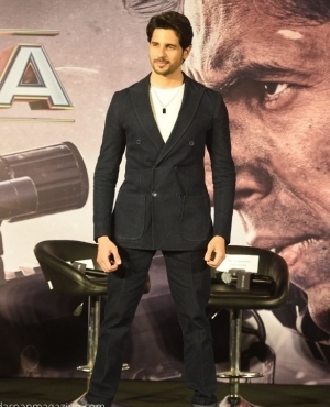 Sidharth Malhotra is hotness overloaded with his suit and suede camel boots 