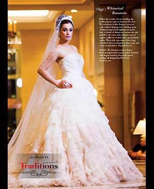 Whimsical Romantic: Reflect the wonder of your wedding day in this princess-style creation by Mori Lee. The sweetheart bodice features crossover, tuck-sculpted shaping and a dazzling spray of shimmering beaded appliqué along the bust. A drizzle of rhinestones accents the side midriff to the waist, where delicate tiers of organza ruffles are washed with a pretty blush ombre. Worn with a gossamer 8-foot long veil, this look is as romantic as they come, and is sure to melt hearts. bryansbride.com Details:  The dramatic couture cherry blossom ring in white crystal opal is accented with elegant teardrop Swarovski crystal earrings, all designed by Elsa Corsi. Jeweliette.com