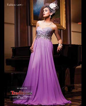 Posh Vintage: Elegant and luxurious, this alluring strapless Morrell Maxie evening gown features a sweetheart bodice that is plastered with glitzy beads. The empire waistline is gorgeously embellished with shimmering rhinestones, from which delicate layers of chiffon drape gracefully to the floor.  bryansbride.com Details: To finish this enchanting look, we chose the classic look of pearls. Three-strand freshwater pearl and marquis crystal necklace and Gatsby-inspired hand jewellery is accented with freshwater pearl and Swarovski crystal earrings, all by Elsa Corsi. The look is finished with a feather flower and birdcage veil. All available at Jeweliette.com