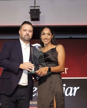 Jasneet Nijjar recipient in the Spirit of Sport category receives award from Riley Wiwchar, Executive Director of Grey Cup 2024 at BC Lions