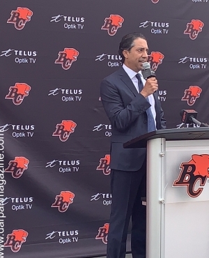 Amar Doman makes speech at mic