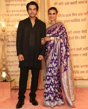 RajKummar Rao looks dapper in his black suit alongside wife Pathralekha Paul in a purple saree 