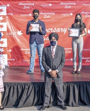 Scholarship winners with owner Baldev Bath 