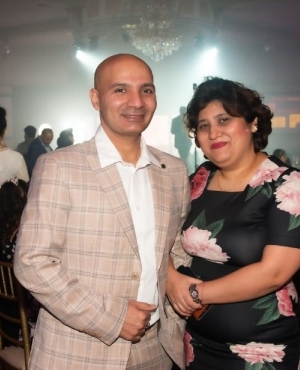 Photographer Sham Sharma and wife pose at the party 