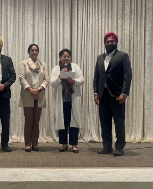 Khalsa Credit Union presents a cheque to the Surrey Food Bank 