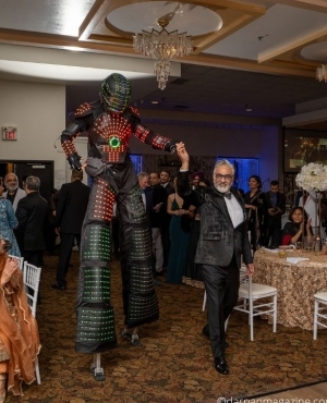 Stilt performer all lit up with Perminder 