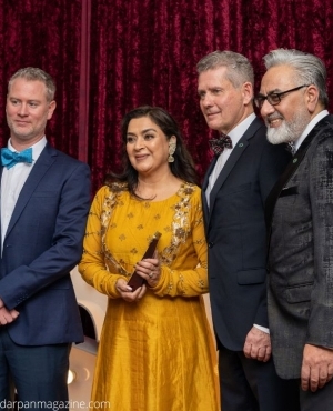 Employee being awarded by Perminder  