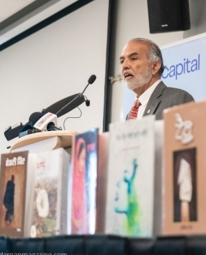Barj Dhahan alongside 3 books that are the finalists for this year's prize 