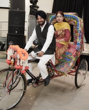 Attendees enjoy an India moment on the rickshaw 