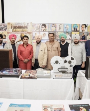 Attendees and organizers take a group photo at the event 