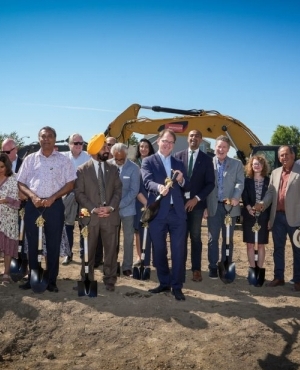 MLA Adrian Dix is all smiles with his shovel 
