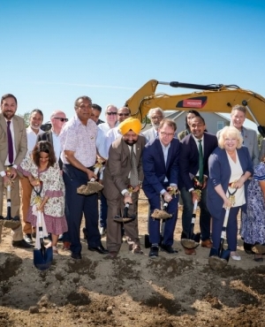 MLA Rachna Singh, PICS CEO Satbir Cheema, MLA Adrian Dix, MLA Ravi Kahlon, Mayor Brenda Locke, and MLA Jimmy Sins dig in 