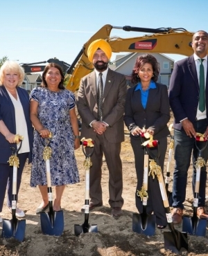 Mayor Brenda Locke, MLA Jinny Sims, CEO of PICS Satbir Cheema, Indra Bahn of SBOT, MLA Ravi Kahlon, and Councillor Linda Annis are smiles with shovels