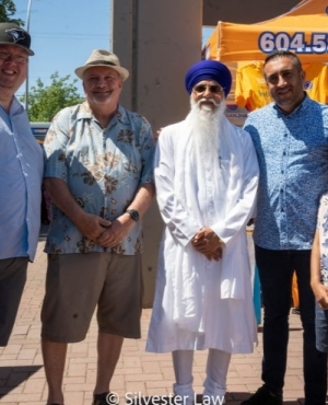 Surrey City Councillor Mandeep Nagar poses with Guru Nanak's Food Bank staff 