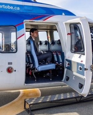 Premier Eby gets ready to go for a ride in the Helijet 