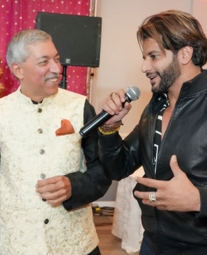 Kamal Sharma with a local singer 