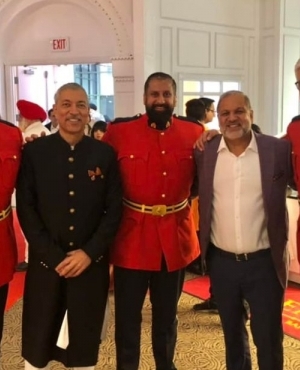 Kamal Sharma with RCMP officers 