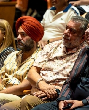 MP for Surrey Newton Sukh Dhaliwal enjoys the performance 