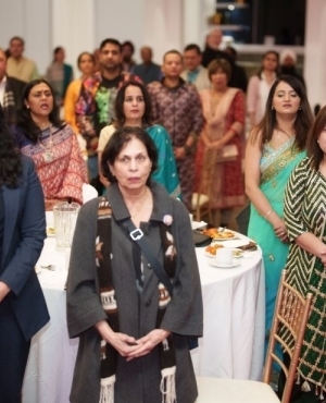  Dignitaries and attendees rise for the national anthem 