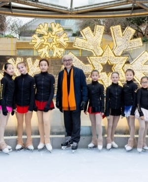 George Chow, Minister of Citizen's Services poses with young skaters 