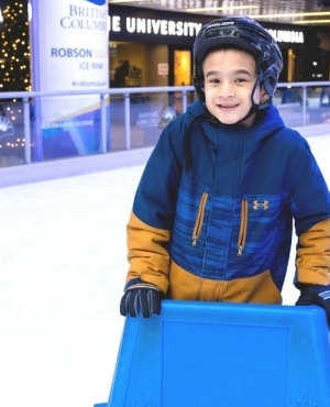 Young skater is all smiles on the ice 