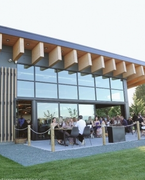 Attendees enjoying the outdoors and wine 