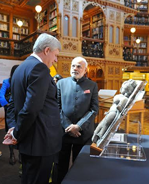 PM Modi visiting the library of Canadian Parliament with Canadian PM, Mr. Stephen Harper at Ottawa 