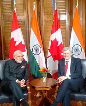 India's PM Modi & Canada's PM Stephen Harper have a Tete-a-tete. 