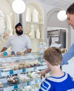 Premier Eby shows the goodies in the case to his son 