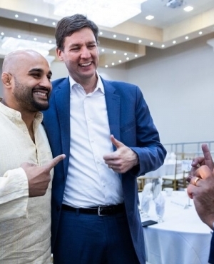 MMA champion Arjan Bhullar and Premier David Eby 
