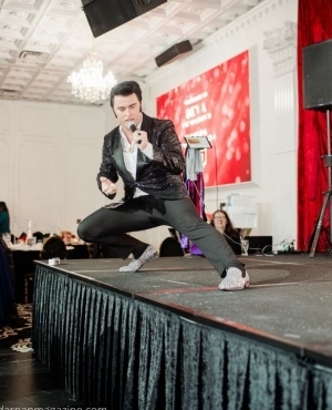 Elvis impersonator in full force on stage 