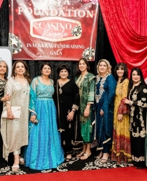 Raj Arneja founder of Seva Thrift Store with attendees which include Gail Bains and Perm Jawanda 