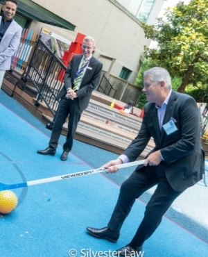 Martin Thibodeau of Regional President of RBC for the BC region tries hand at ball hockey