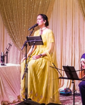  Amrita sings completely absorbed with the rest of the live musicians 