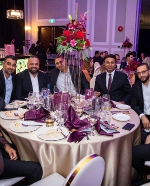 Guests at mayor's evening of giving pose for a picture 