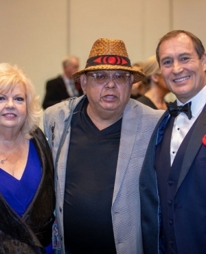 Mayor Brenda Locke and Mike Madryga of Global BC who was the MC for the event poses with the mayor along with an Indigenous elder 