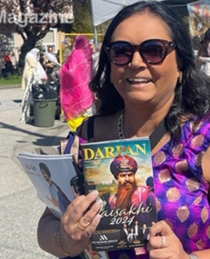 Past President of BC Nurses Union Aman Grewal with a copy of the Darpan Vaisakhi issue 
