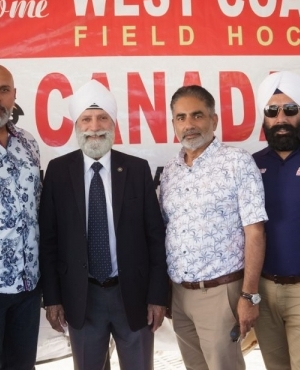  Balraj Mann of BM Group of Companies, Tochi Sandhu of Khalsa Credit Union, and organizer Udham Singh Hundal pose at the event 