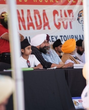 Surrey City councillor Mandeep Nagra alongside a panel of judges 