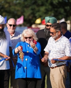   Surrey Mayor Brenda Locke cuts the ribbon to kick start the ceremony