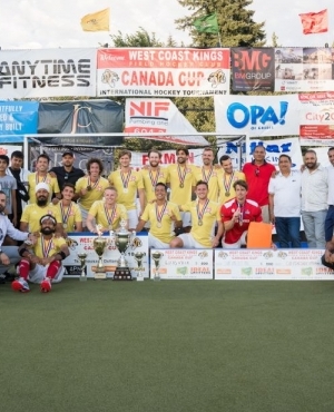  Athletes pose with medals around their neck 